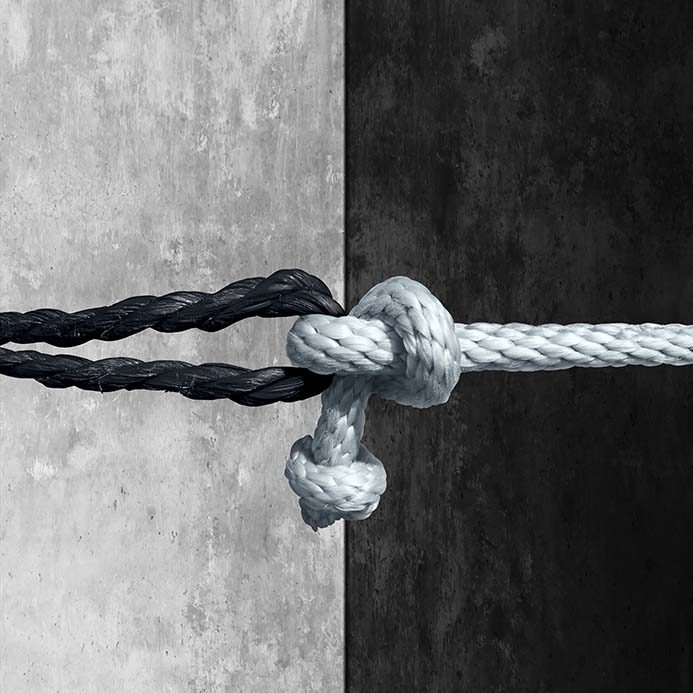 Two ropes black and white knotted together