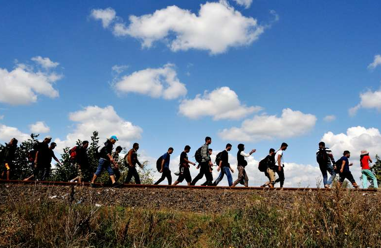 Refugees walking along an old railway line, just after crossing from Serbia into Hungary.©UNHCR/M.Henley