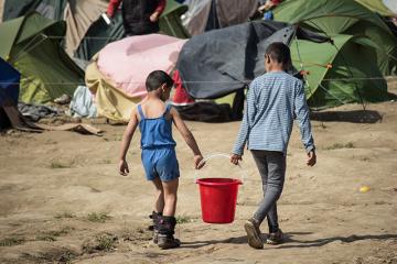 Two children in a refugee camp in Idomeni, Greece