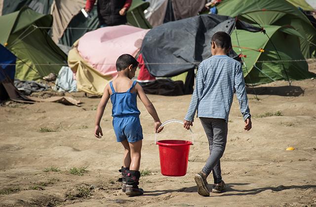 Two children in a refugee camp in Idomeni, Greece
