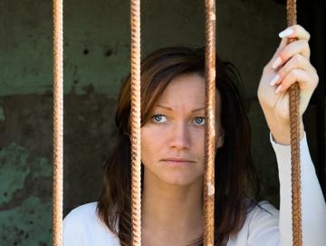 Woman behind bars