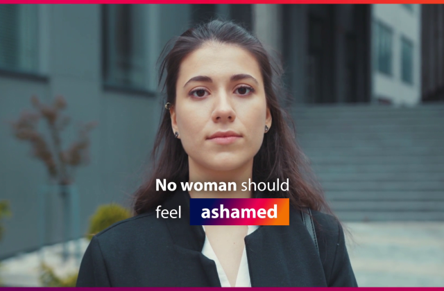 No woman should feel ashamed. Young woman looks at the camera.