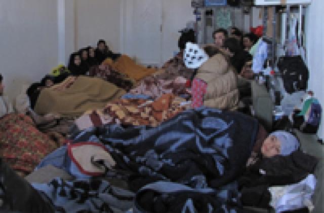 Situation in the detention centre: people crowding in a small room on the floor