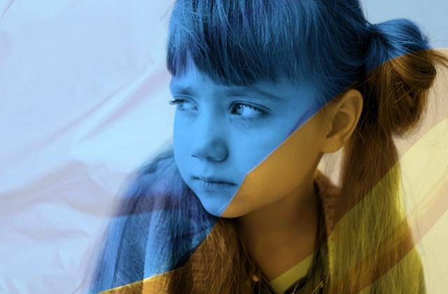 Sad young girl in Ukrainian colours