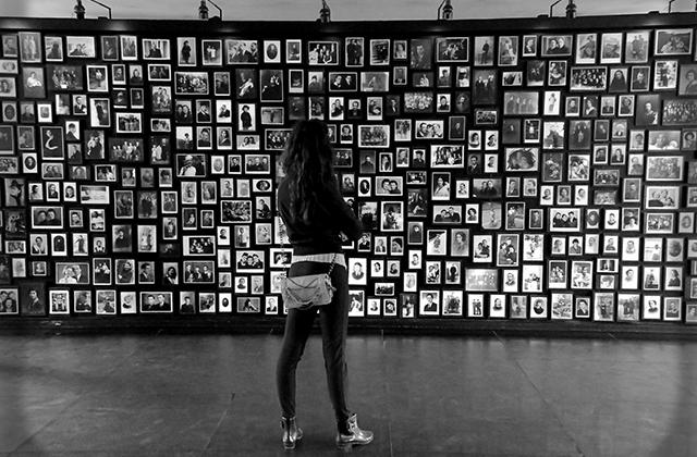 Young woman looks at a Holocaust memorial
