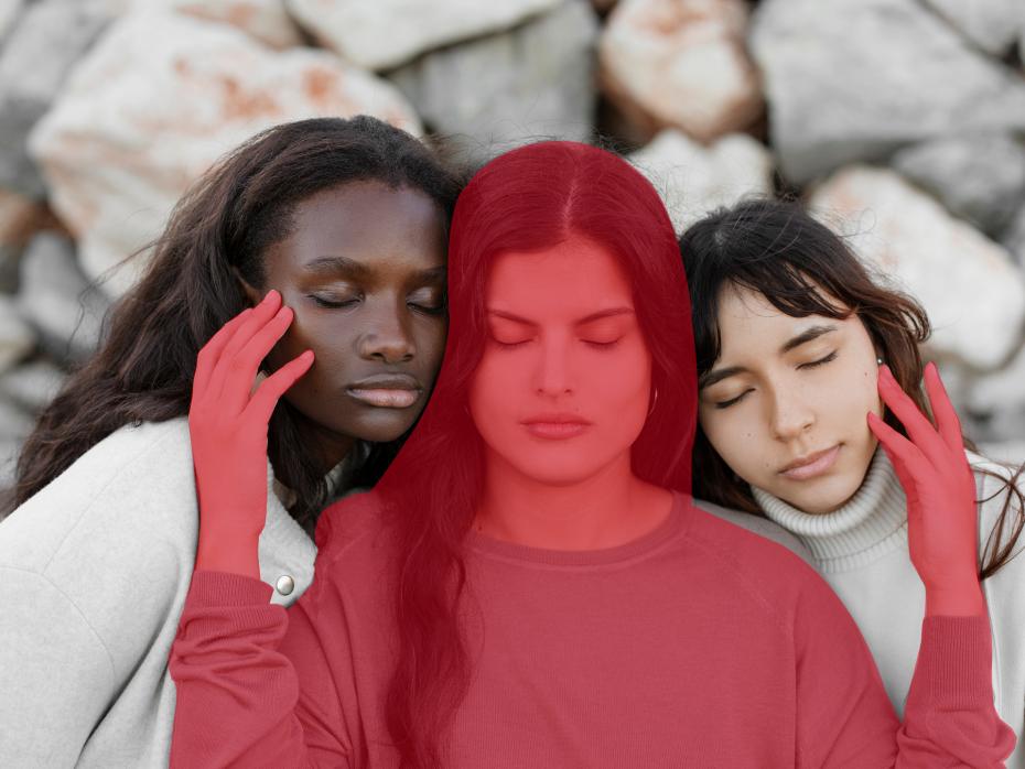 3 young women together with eyes closed. The central woman is shaded red.